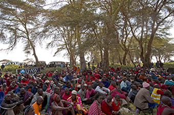 Many members of the Maasai community gather to watch the signing of a lease agreement: between IFAW and the Maasai community, 17 July 2013, Amboseli National Park, Kenya. © IFAW/K. Prinsloo